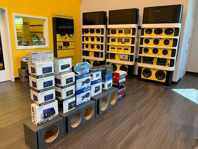 Car audio display wall of head units, speakers and subwoofers