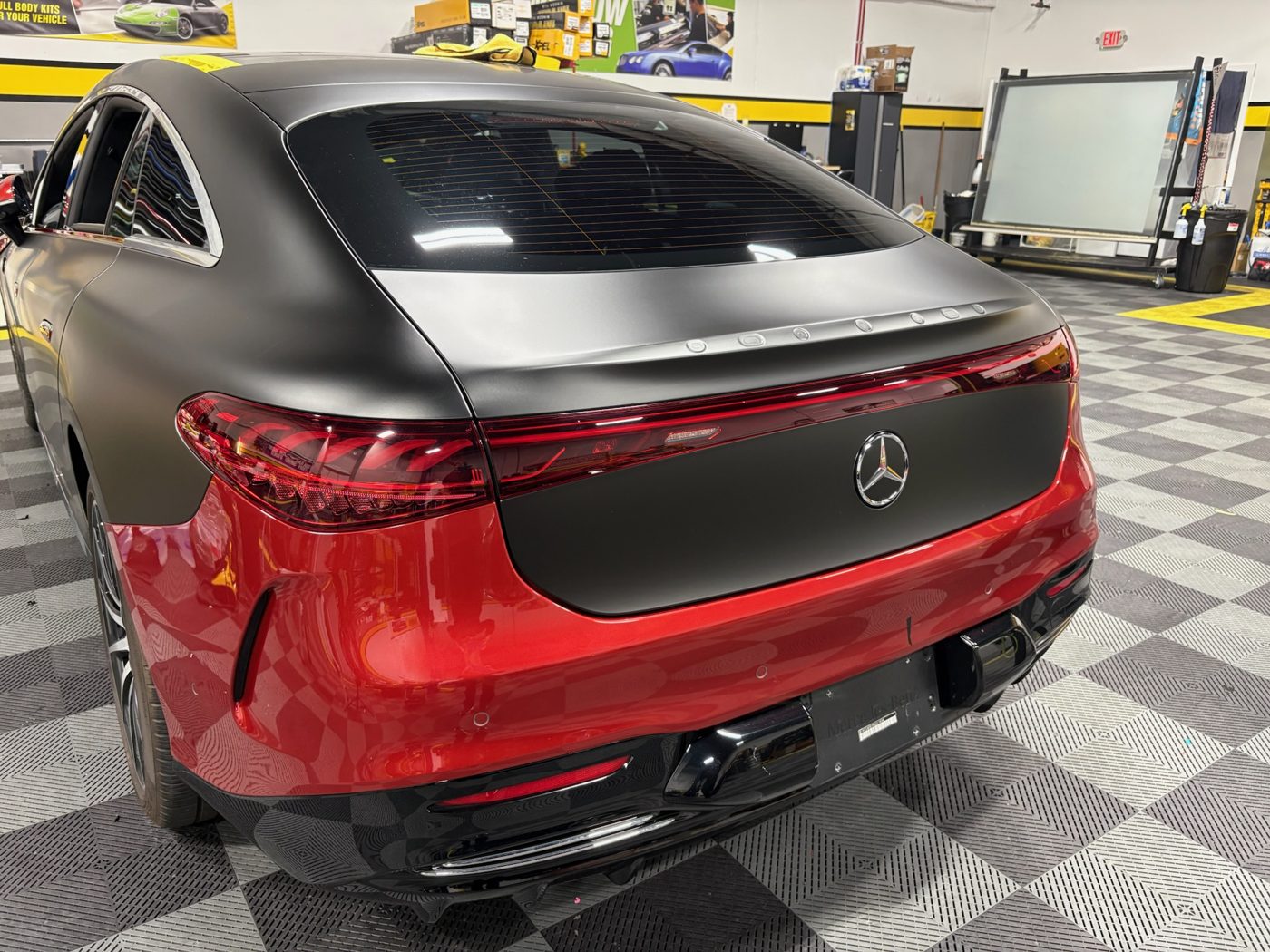 Mercedes EQS in red with a satin black roof and trunk wrap